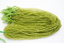 Load image into Gallery viewer, (1 row 36 cm 100 grains) High quality large peridot button cut rondel cut 4.5-5.5 x 3.5 mm