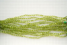 Load image into Gallery viewer, (1 row 36 cm 100 grains) High quality large peridot button cut rondel cut 4.5-5.5 x 3.5 mm
